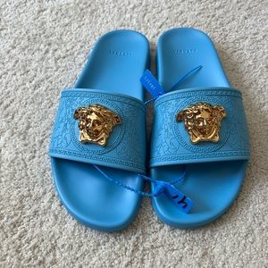 Versace Electric Blue Slides. New w/o tags or box.  Never worn.